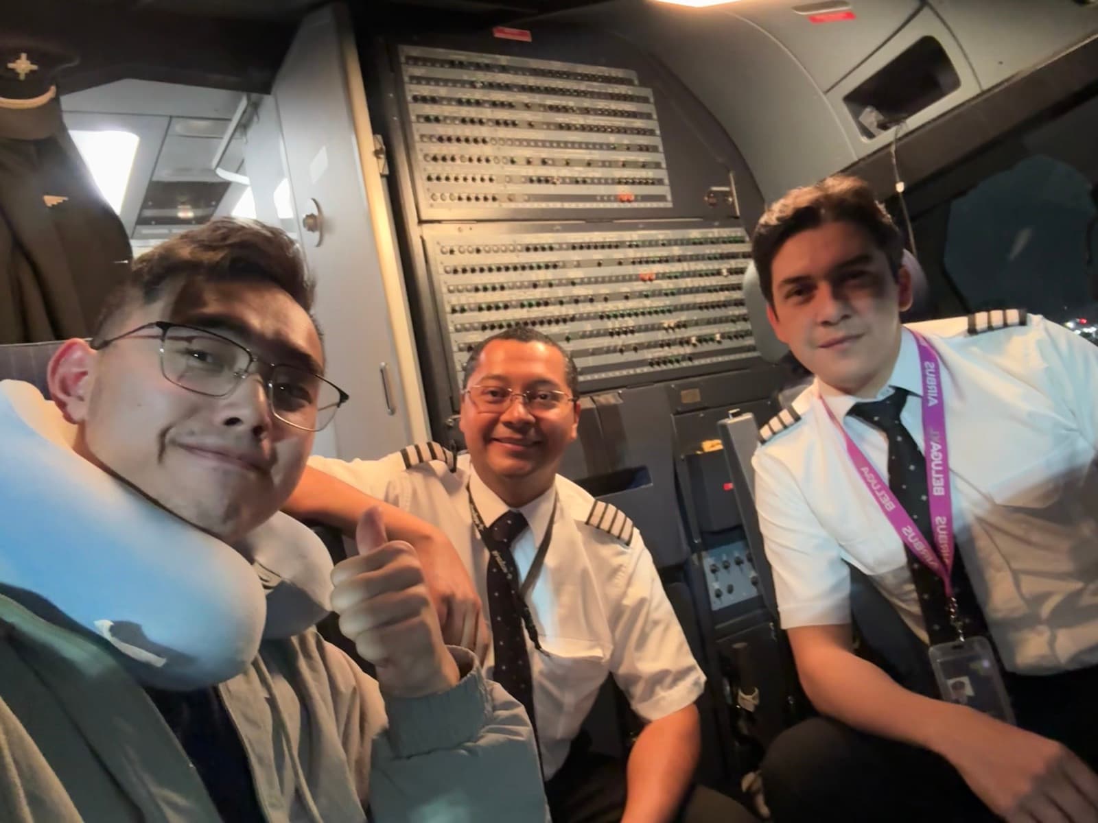 Carter with the flight crew in the cockpit